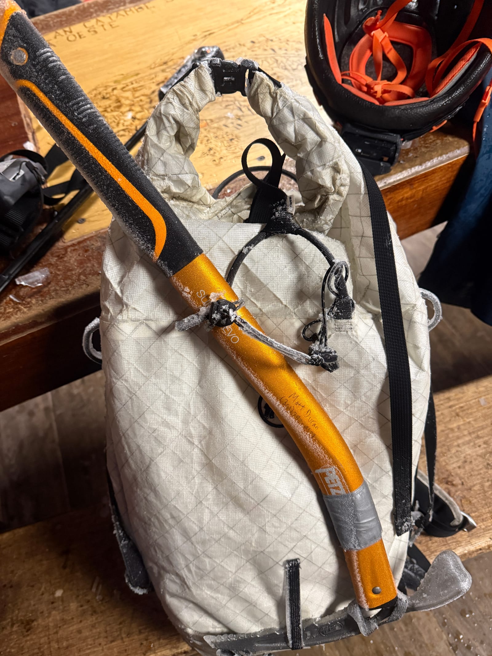 My pack, ice axe, and helmet on one of the Refugio tables, a little crusted over.
